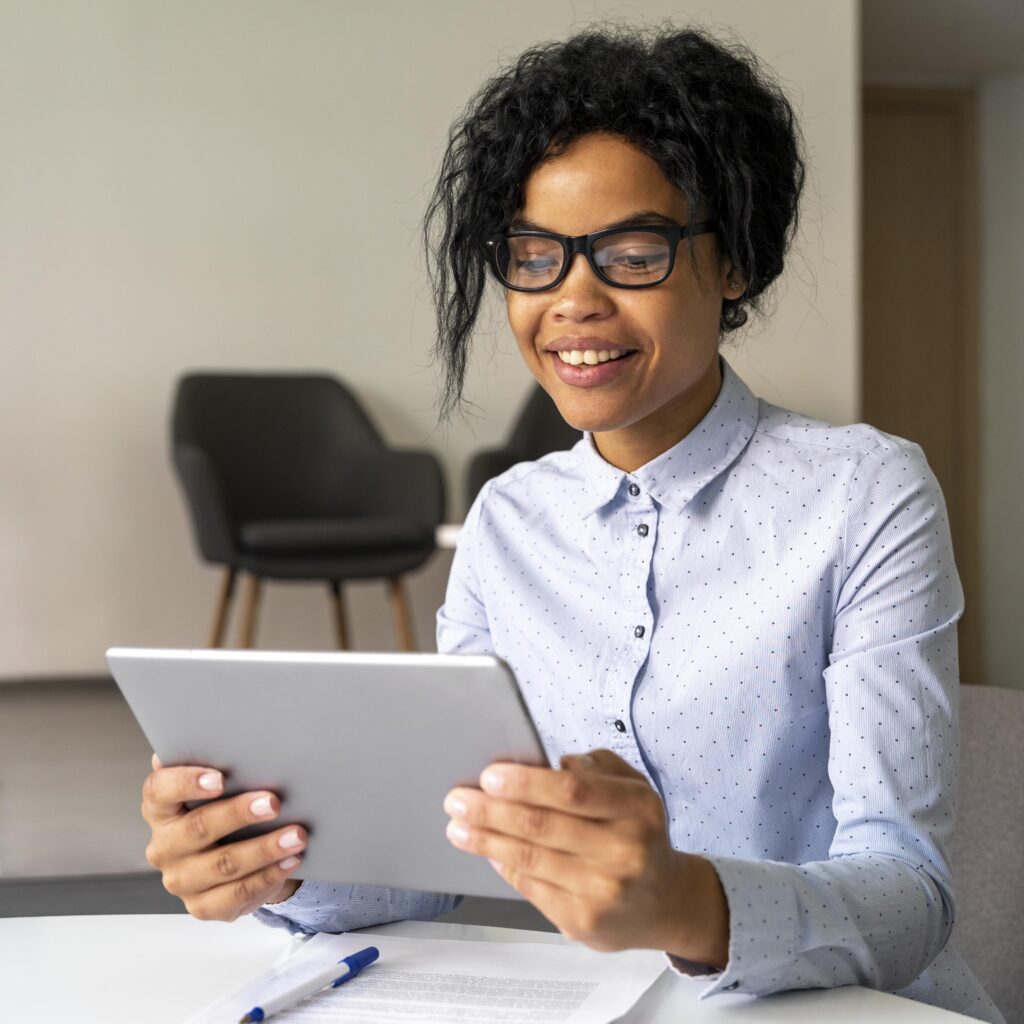 medium shot woman holding tablet